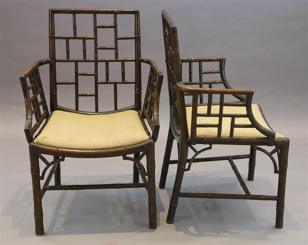 A set of four George III stained mahogany and beech simulated bamboo cockpen elbow chairs, W.2ft 2in. D.1ft 8in. H.3ft 1.5in.